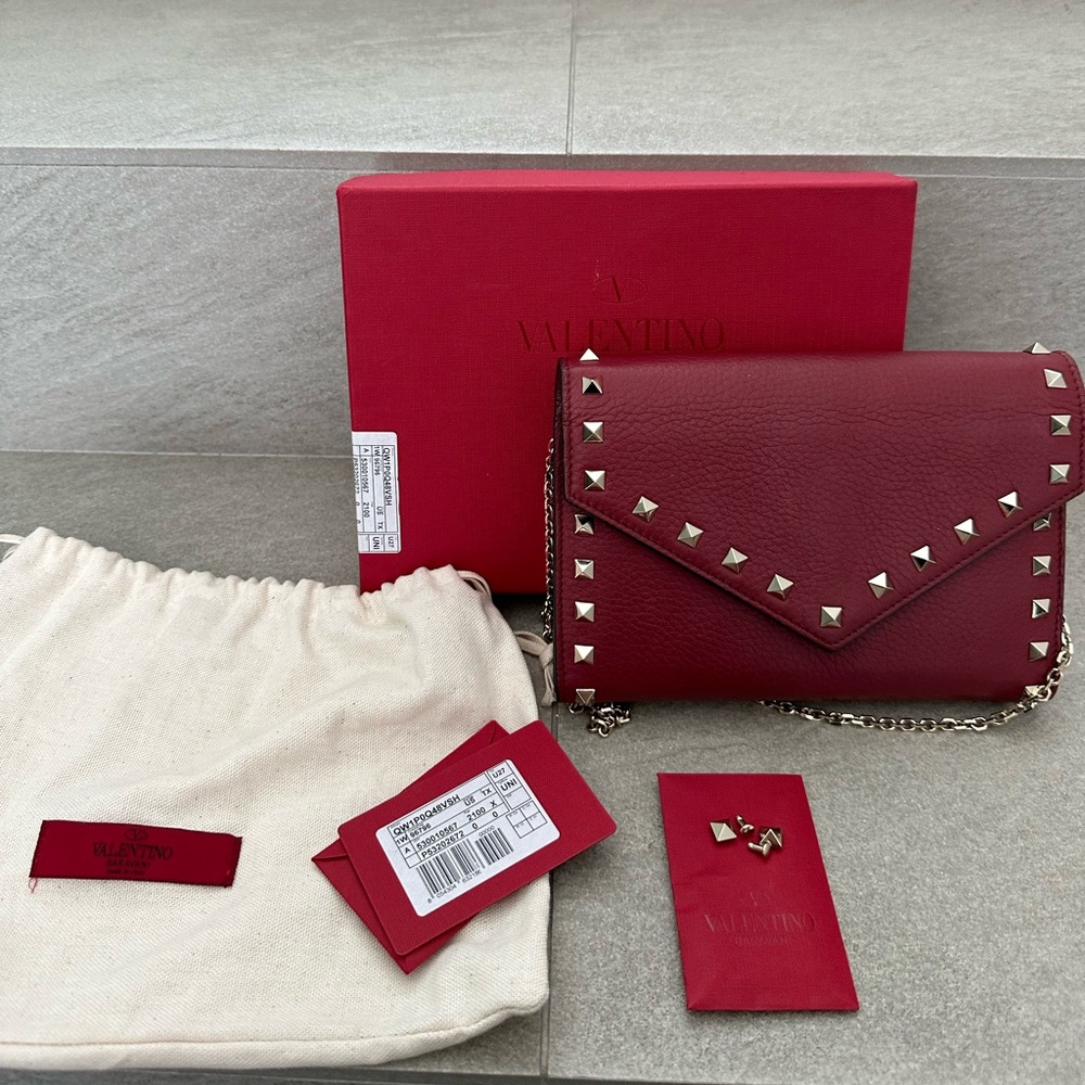 Valentino Garavani Rockstud Wallet on a chain. Color dark red